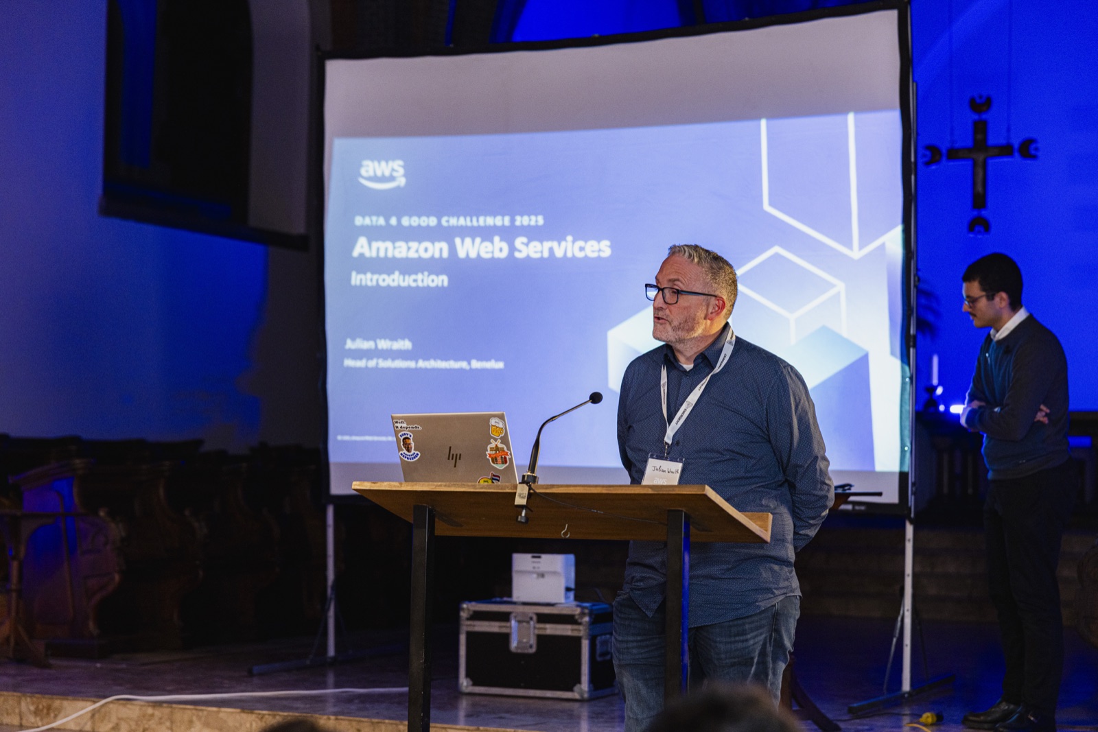 An AWS guest speaker addressing Emergent attendees